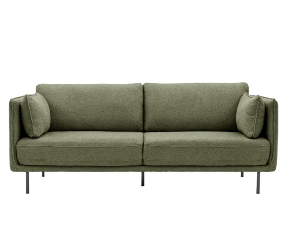 Modern green boucle sofa for a pink and green living room