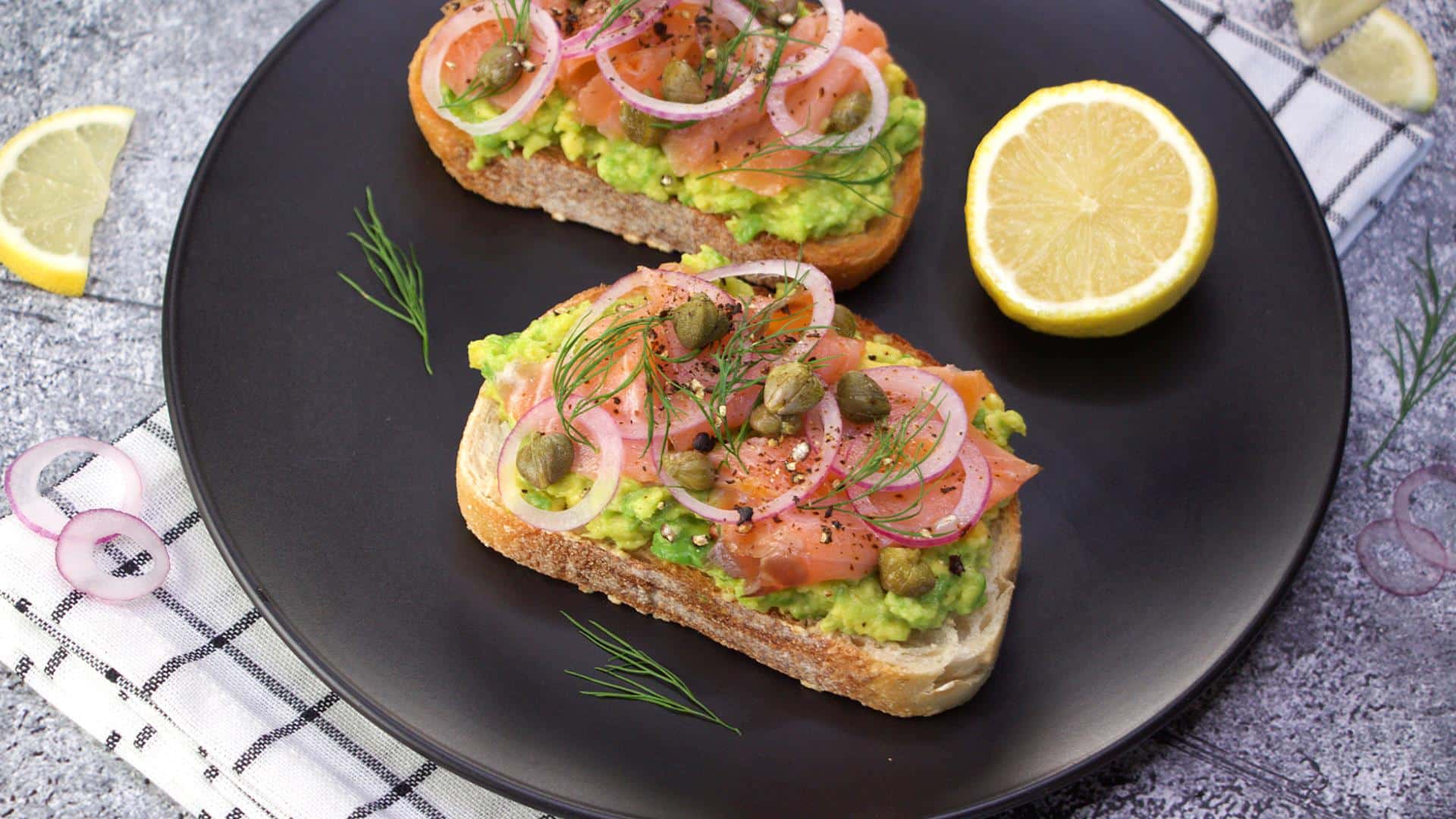 Smashed avocado on toast with smoked salmon