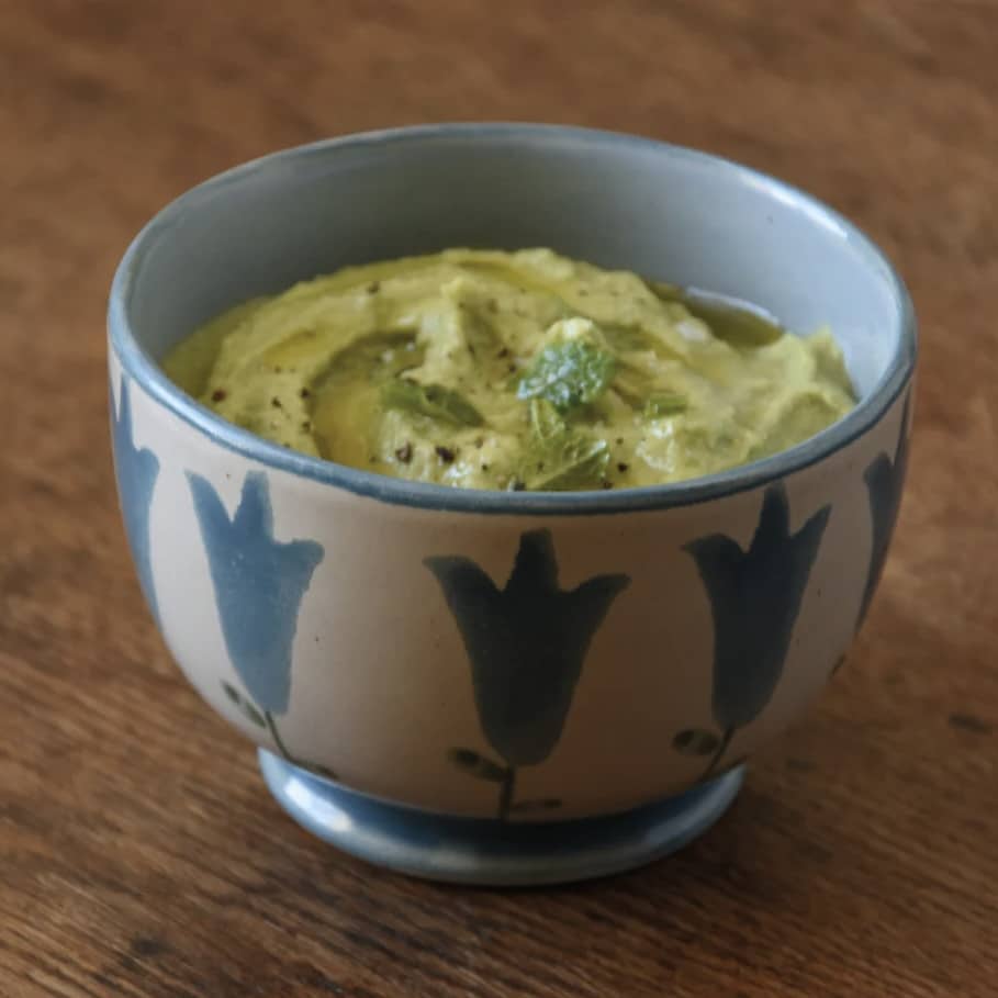 ANTA Harebell Small Bowl filled with dip on a wooden surface – handmade stoneware from the Scottish Highlands