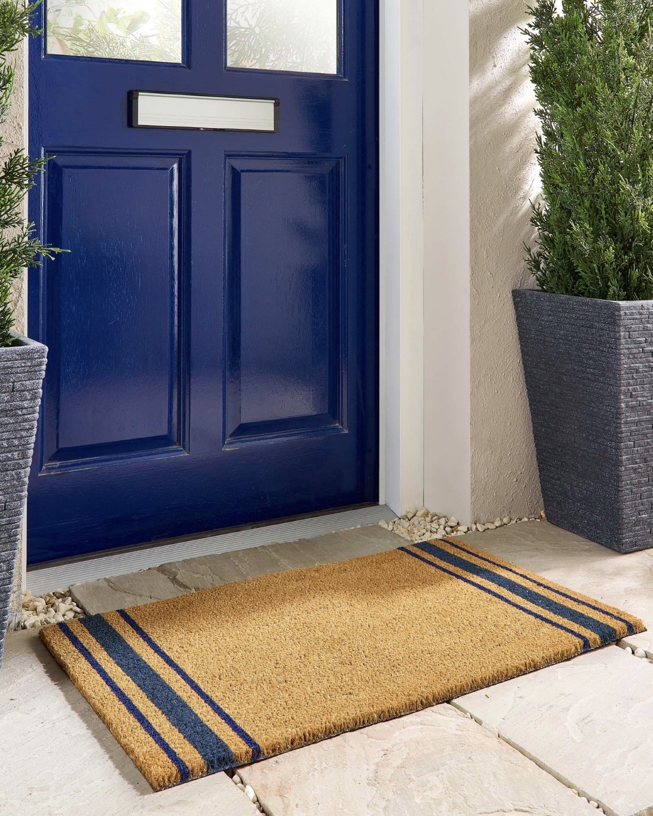 Navy Border Stripe Coir Doormat for a coastal home entrance