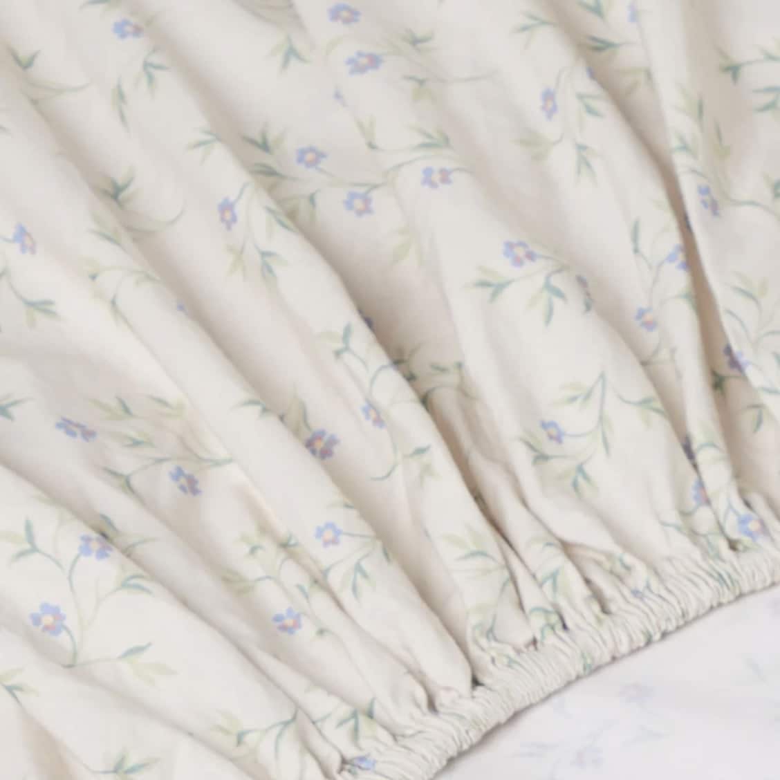 cream spring sprig cotton fitted sheet with delicate floral print for cottage bedroom
