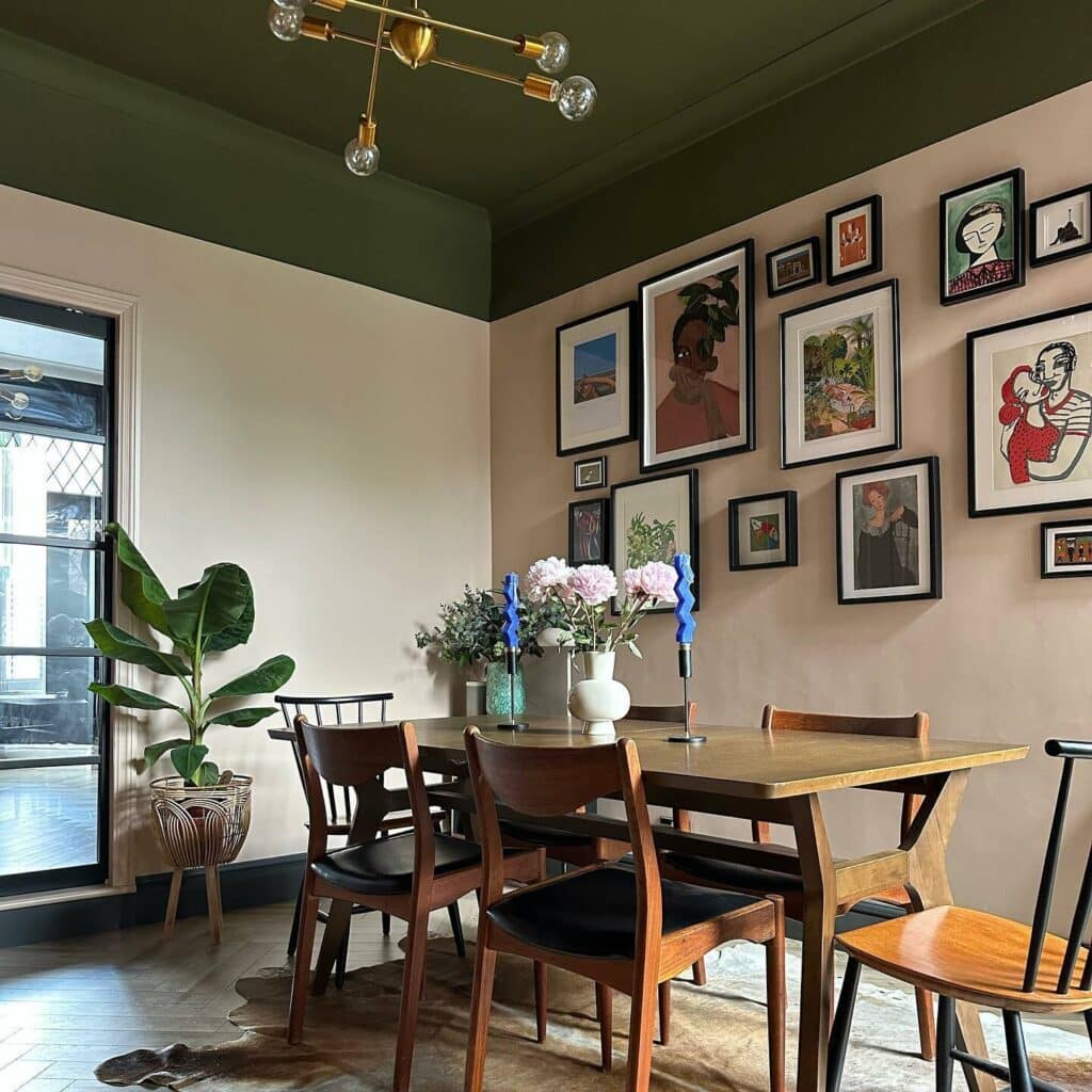 dining room with Farrow and Ball Bancha painted ceiling, Setting Plaster walls and curated gallery wall above a wood dining table