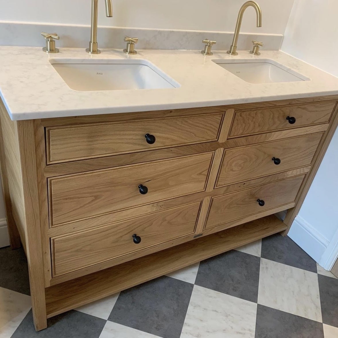 Chelmsford double oak vanity unit with brass taps on marble top