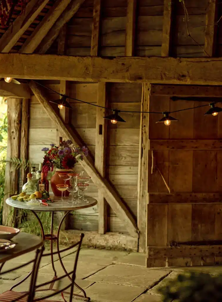 Rowen & Wren Ives Outdoor String Light draped across a pergola above a garden dining table — lighting ideas for evening garden dining