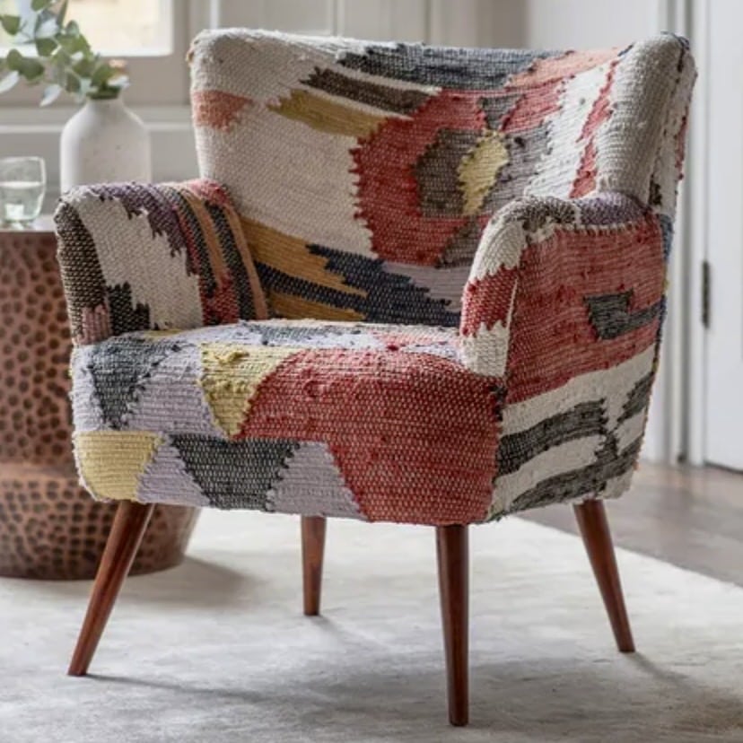 Arte Armchair in a colourful geometric woven pattern with tapered wooden legs