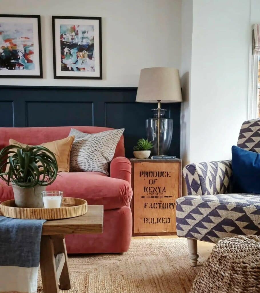 Living room with Hague Blue wall panelling, pink sofa and geometric patterned accent chair