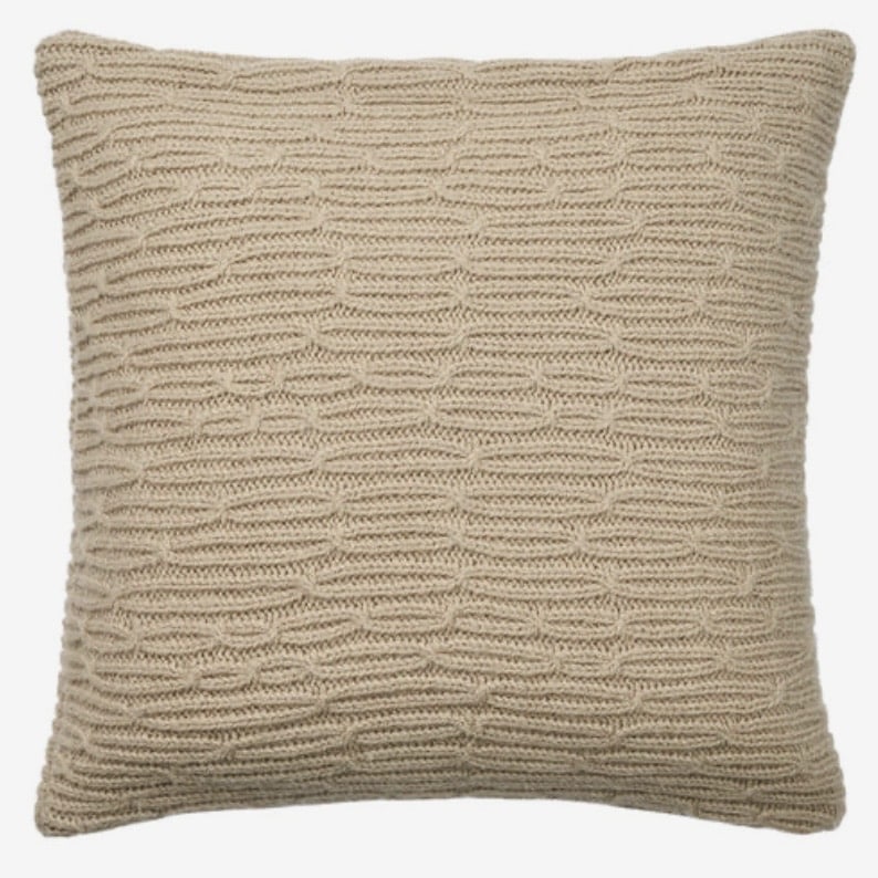 Bolia Plover cushion in sand wool — ribbed knit texture cushion to balance a tan leather sofa living room