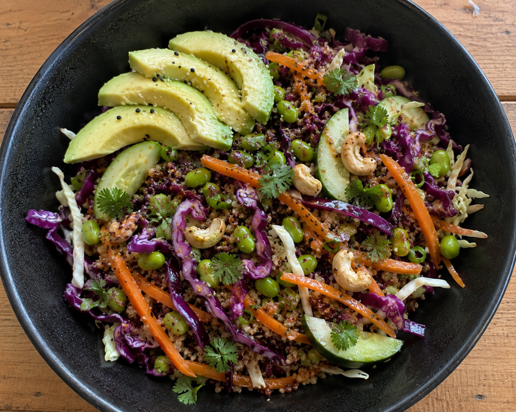 Asian slaw with quinoa, edamame, avocado, red cabbage, carrot, cucumber and creamy almond ginger dressing