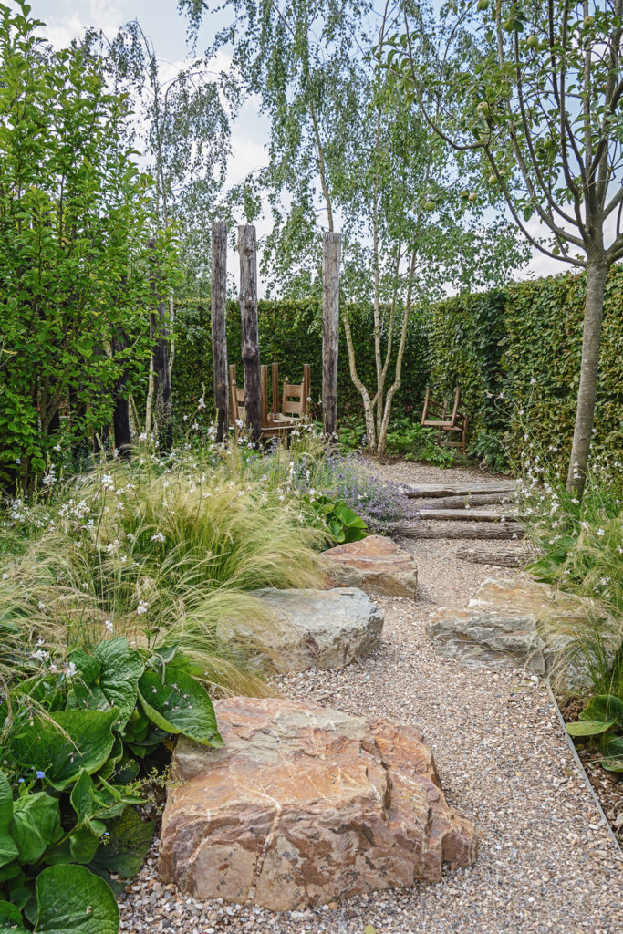 Gravel path edged with large stone boulders, garden path ideas