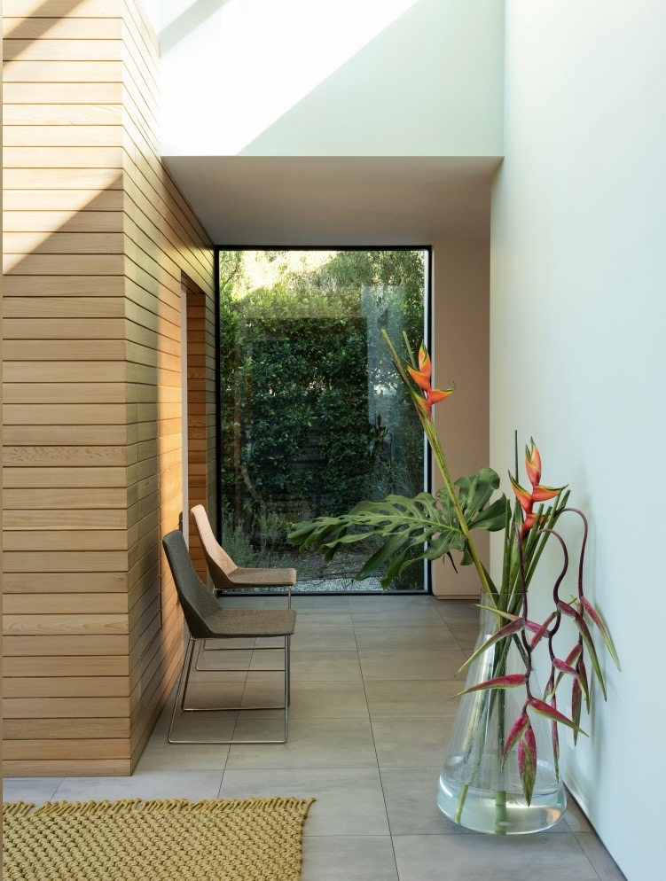 Green hallway panelling ideas – wood-clad entrance hall in Farrow & Ball Palm