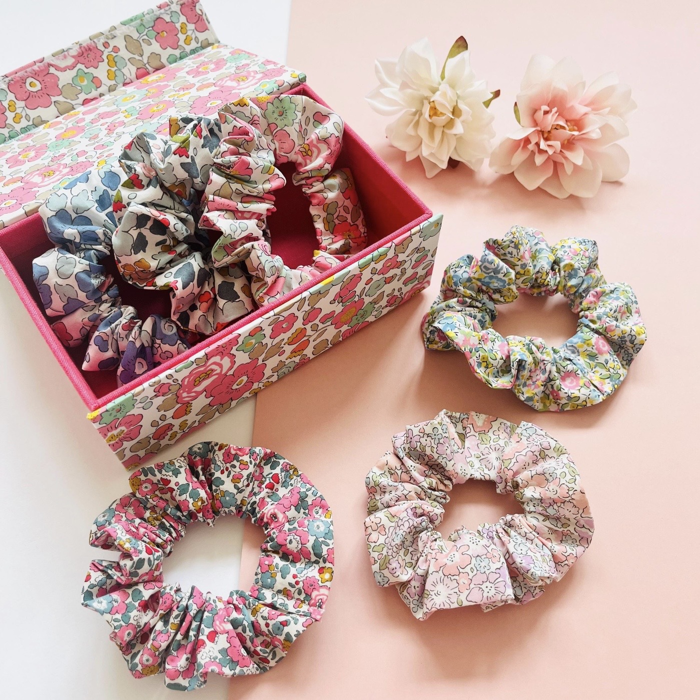 Liberty of London floral fabric hair scrunchies in assorted pink, blue and green prints