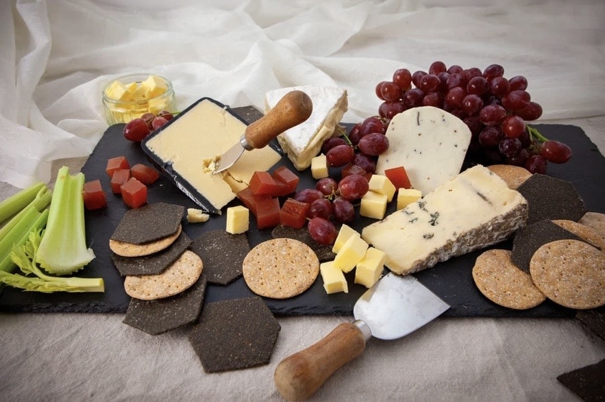 Shropshire Cheese Board with brie, blue cheese, grapes and crackers on a slate board
