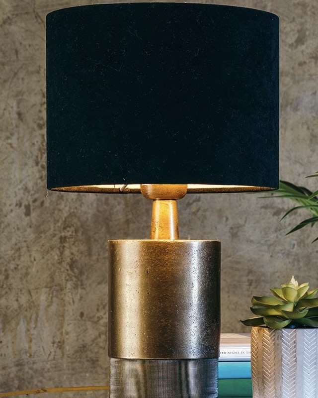 Brass table lamp for a black and beige bedroom