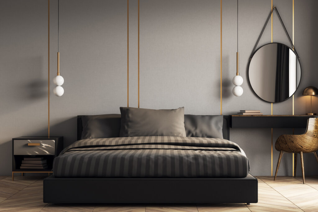 grey and black bedroom with brass pendant lighting
