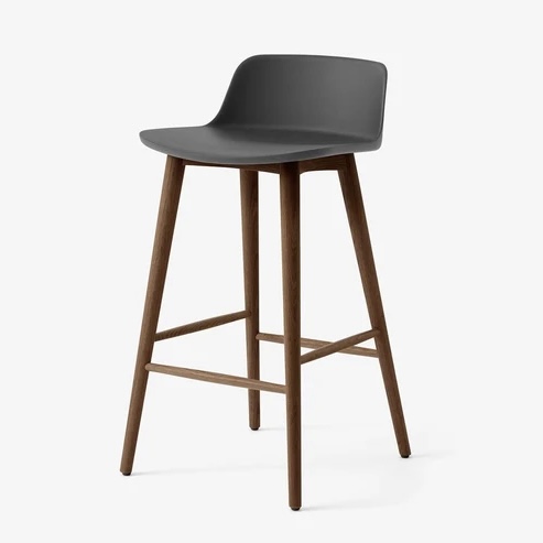 Rely bar stool with a dark grey moulded shell seat on slim oak legs