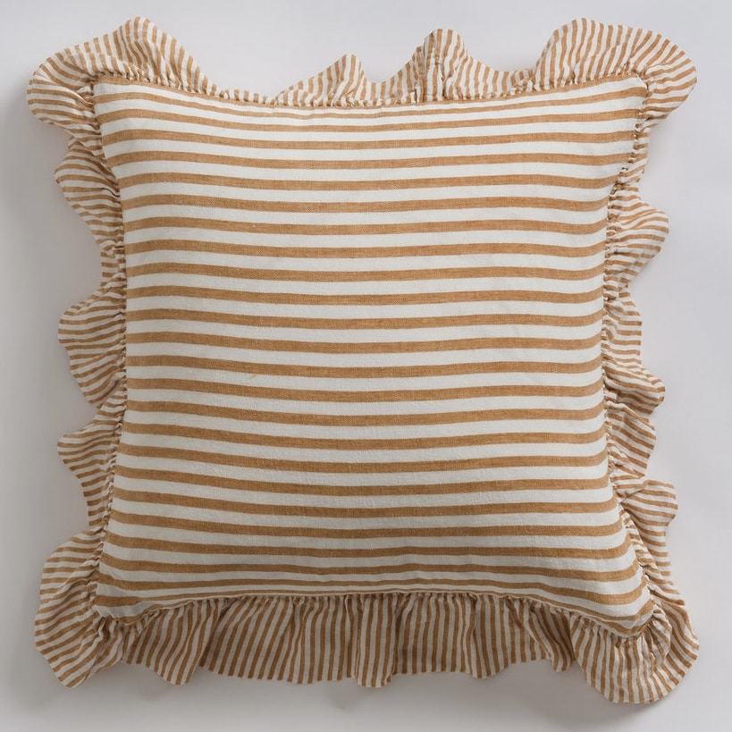 Amber and white striped linen cushion with a frilled edge