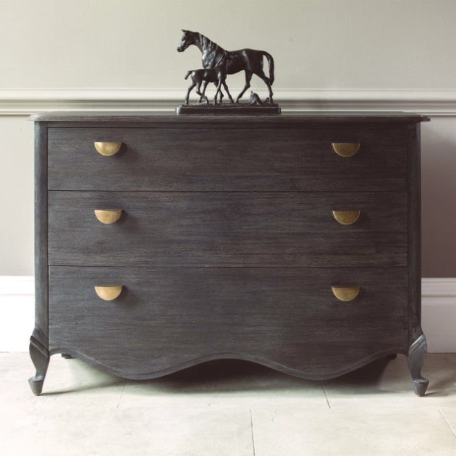 Dark wood Brompton chest of drawers with curved front and brass handles