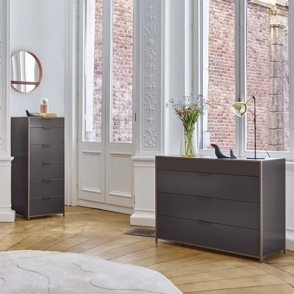 grey chest of drawers in grey and white bedroom