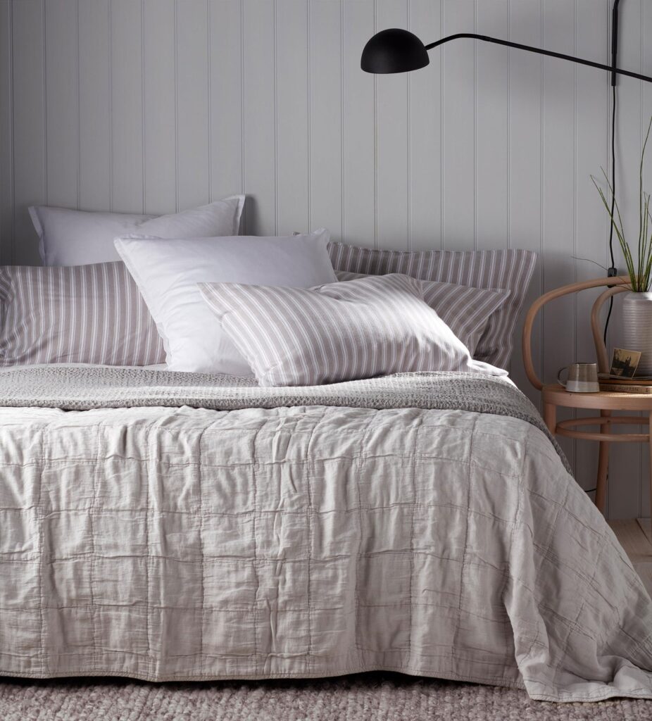 grey quilted throw in grey bedroom