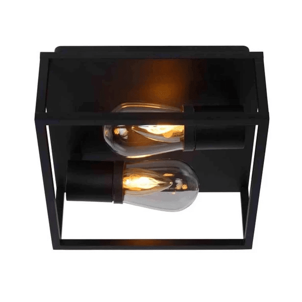 Lucide Carlyn cage-style flush ceiling light above a round mirror and stone vessel sink in a dark tiled bathroom