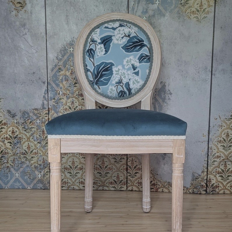 Louis-style medallion accent chair with a blue botanical print back and teal velvet seat on a limed oak frame