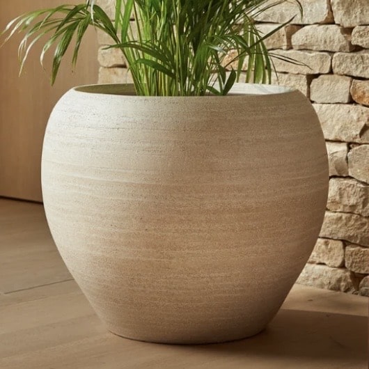 Amora off-white ceramic indoor plant pot for a boho beige bedroom