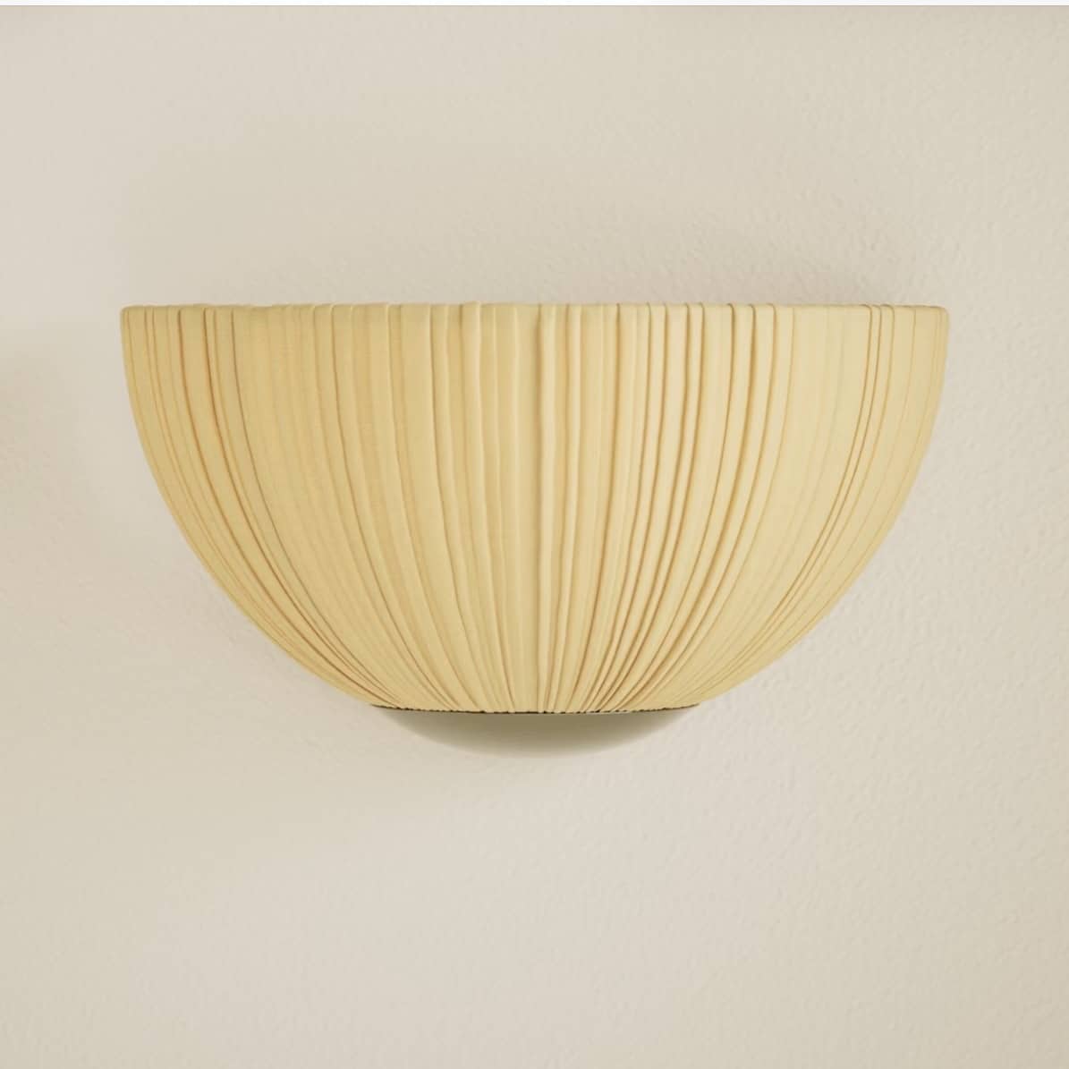 Pleated fabric flush wall light in natural for warm beige bedroom lighting