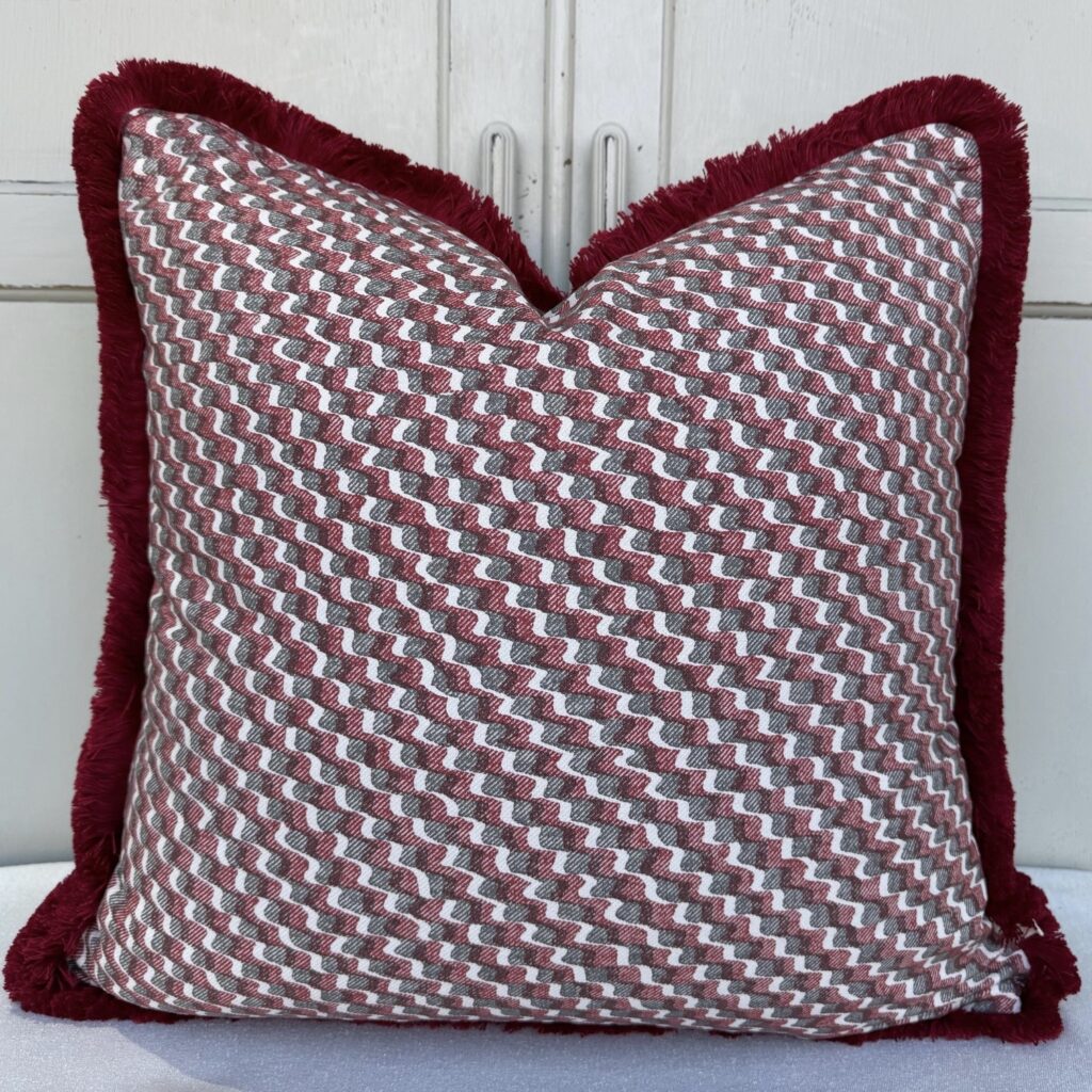 Red and grey Fermoie zigzag cushion with burgundy fringed edge