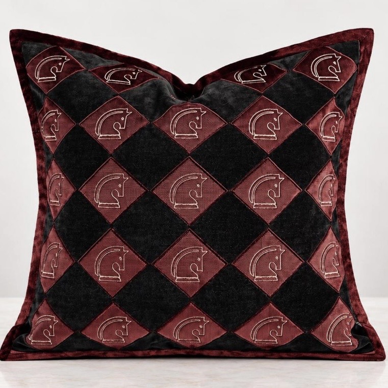 Burgundy and black diamond velvet cushion with embroidered knight motifs