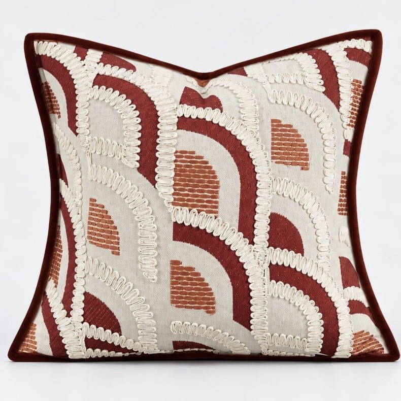 Art deco cushion with rust and burgundy embroidered scallops on natural linen
