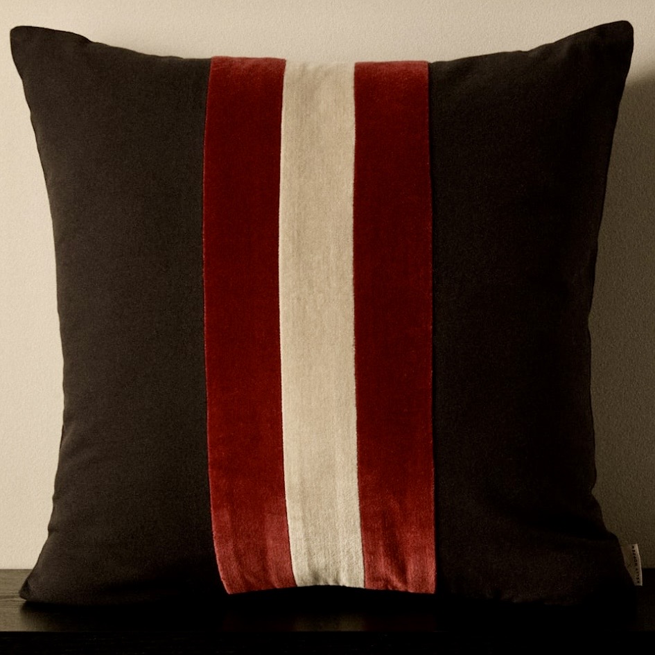 Black cushion with burgundy velvet and stone central stripes