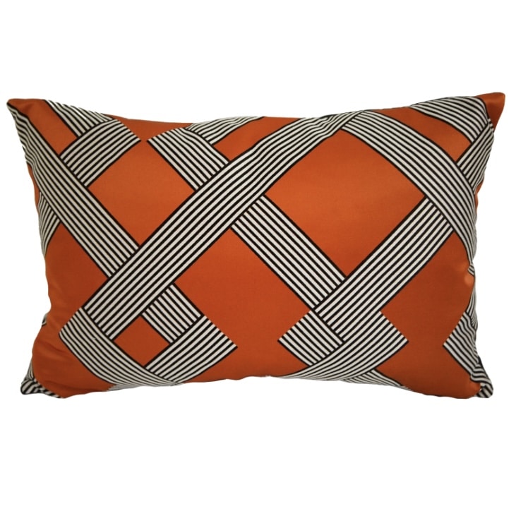 Orange Manuel Canovas Derain cushion with interlocking black and cream striped bands