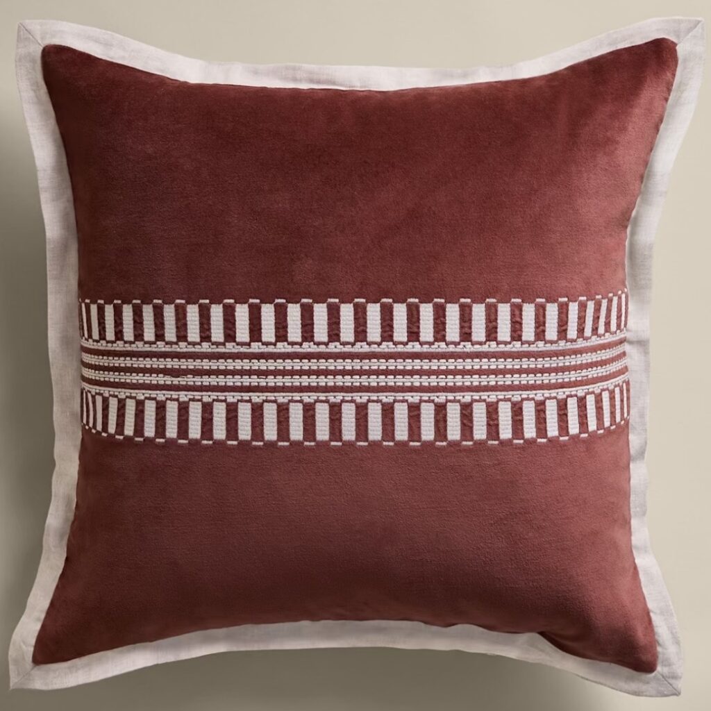 Chestnut velvet cushion with cream embroidered panel and linen border