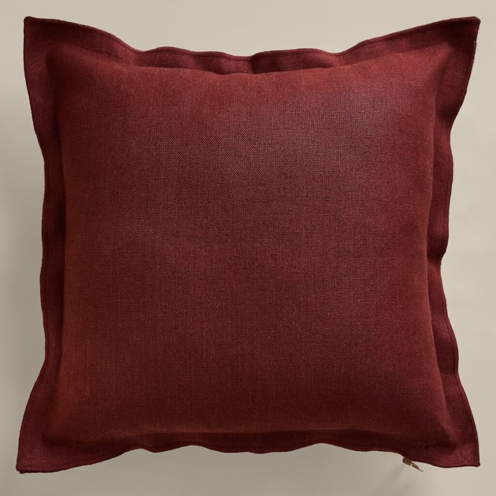 Deep chestnut linen cushion with Oxford border