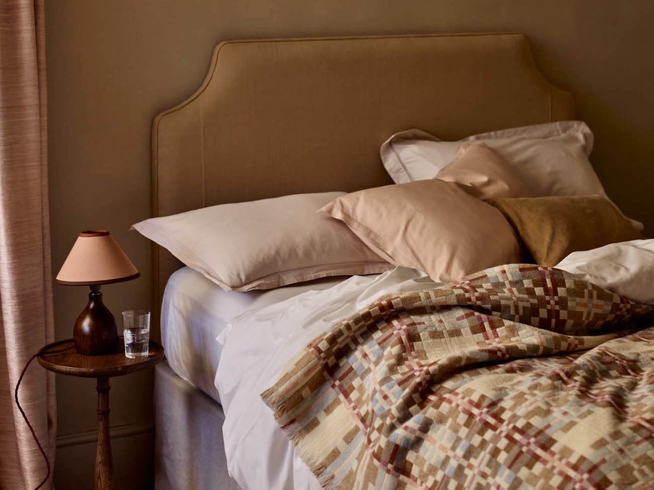 Green and beige bedroom with an apple green velvet bed